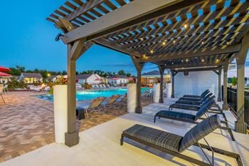 poolside pergola and lounge seating  at Anthem Apartments and Luxury Rental Homes in Huntsville, AL